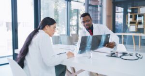 Orthopedic doctors discussing Patient's X-ray