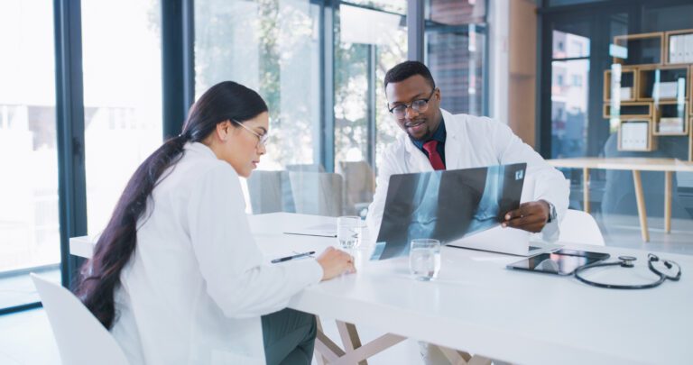 Orthopedic doctors discussing Patient's X-ray